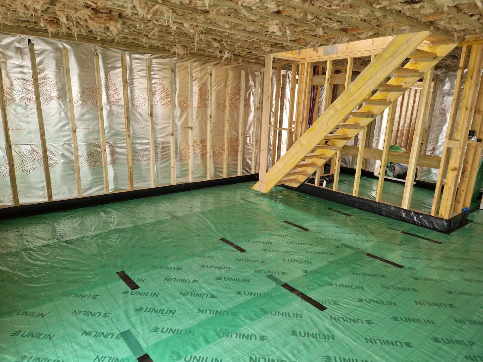Timber frame walls insulated, with the stairs in