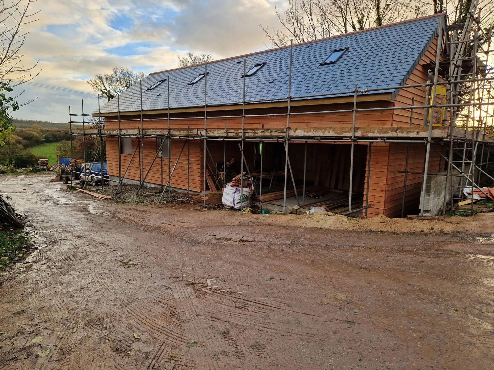 Timber-clad new build with the roof on